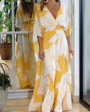 Dámské šaty Calypso – Elegantní květinové šaty s kontrastními detaily a ženským střihem